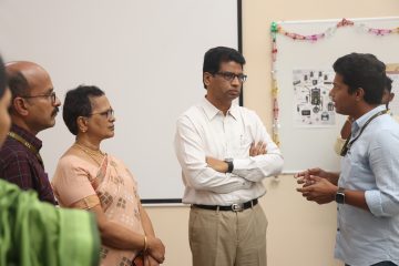 Dr. Sekar Viswanathan listening to the explanation of the vit employee about the drone.