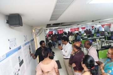 Dr. Sekar Viswanathan listening to the explanation of the vit employee about the drone.