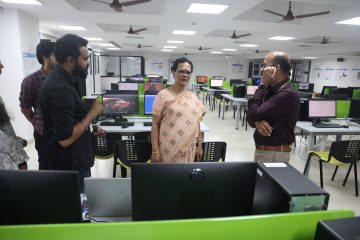 Dr. Kanchana Bhaaskaran listening to the explanation of the vit employee about the drone.