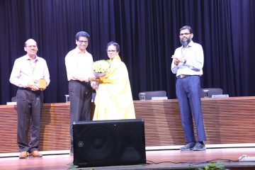 Dr. Sekar Viswanathan welcoming Dr. Kanchana Bhaaskaran as the new vice chancellor of VIT with shawl and bookey.