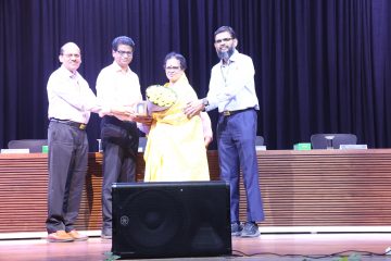 Dr. Sekar Viswanathan welcoming Dr. Kanchana Bhaaskaran as the new vice chancellor of VIT with shawl and bookey.