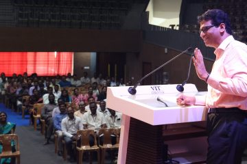 Dr. Sekar Viswanathan giving welcoming speech about Dr. Kanchana Bhaaskaran's successful contribution as the pro vice chancellor.